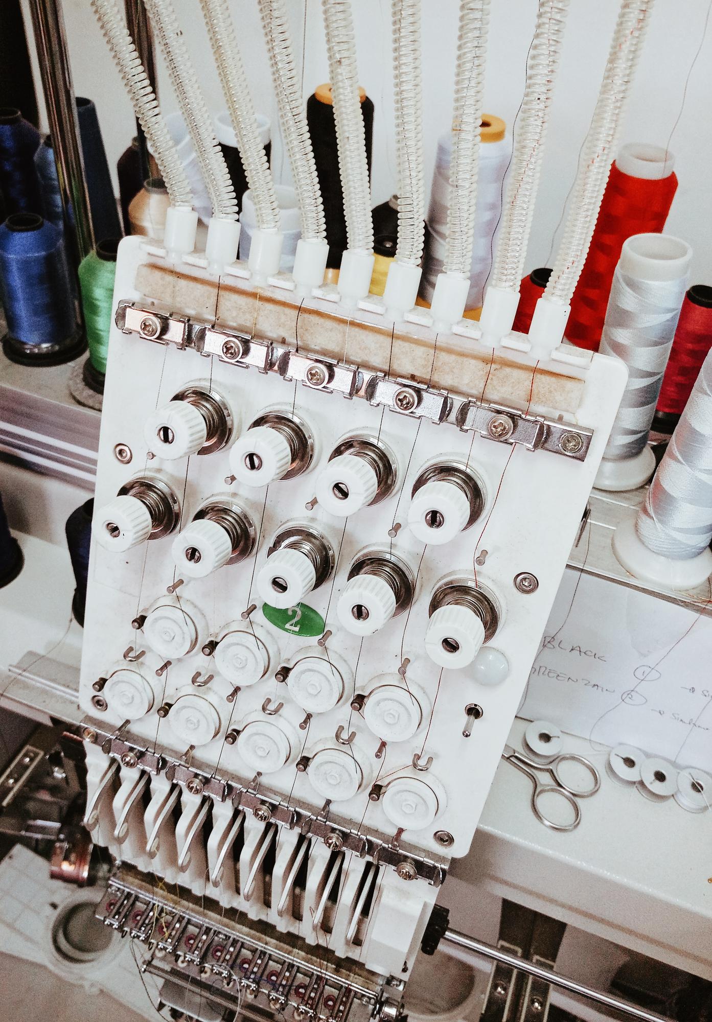 atelier corner with machines and stitched samples